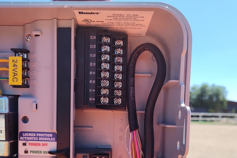 Hunter PC-400 irrigation controller wired up in its outdoor enclosure